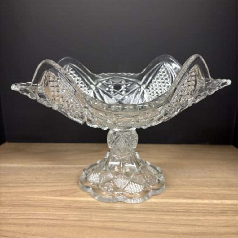 Two Pieces of Vintage American Pressed Glass Including a Whirling Star Pattern Compote and a Diamond Point Cake Stand