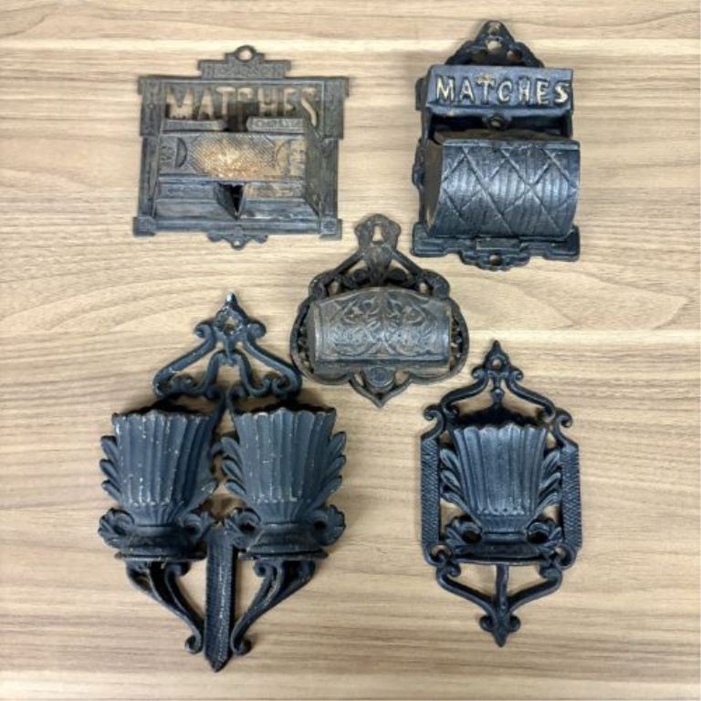A Group of Five Victorian Cast Iron Wall Mounted Match Holders and Decorative Wall Pockets