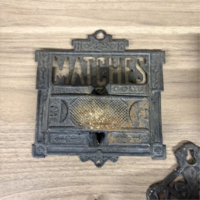 A Group of Five Victorian Cast Iron Wall Mounted Match Holders and Decorative Wall Pockets