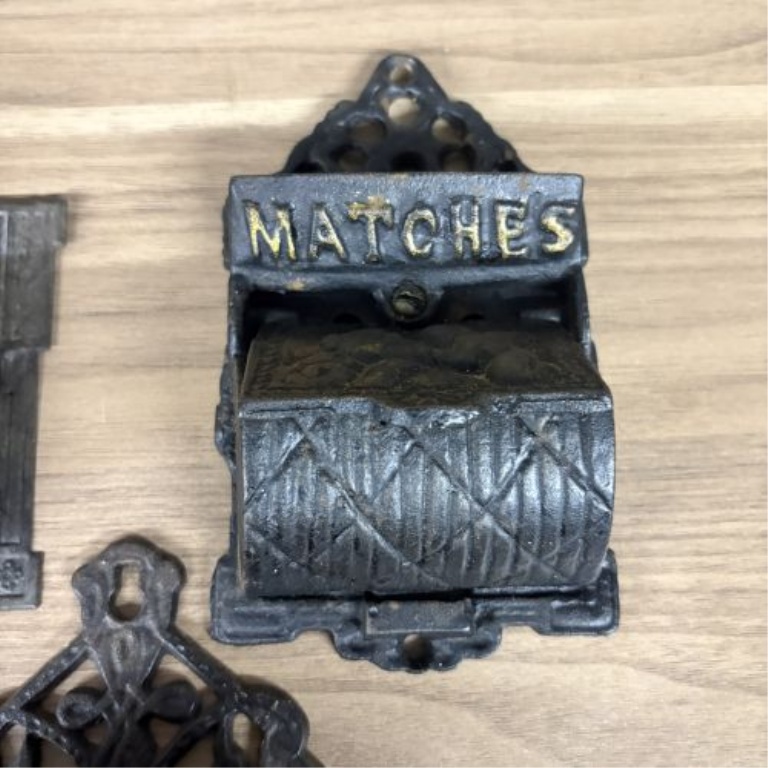 A Group of Five Victorian Cast Iron Wall Mounted Match Holders and Decorative Wall Pockets