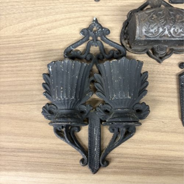 A Group of Five Victorian Cast Iron Wall Mounted Match Holders and Decorative Wall Pockets
