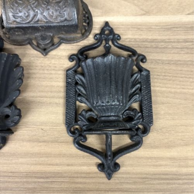 A Group of Five Victorian Cast Iron Wall Mounted Match Holders and Decorative Wall Pockets