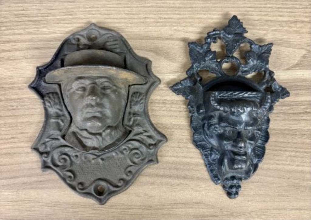 Two Victorian Cast Iron Wall-Mounted Match Pockets including Horace Greeley Depiction