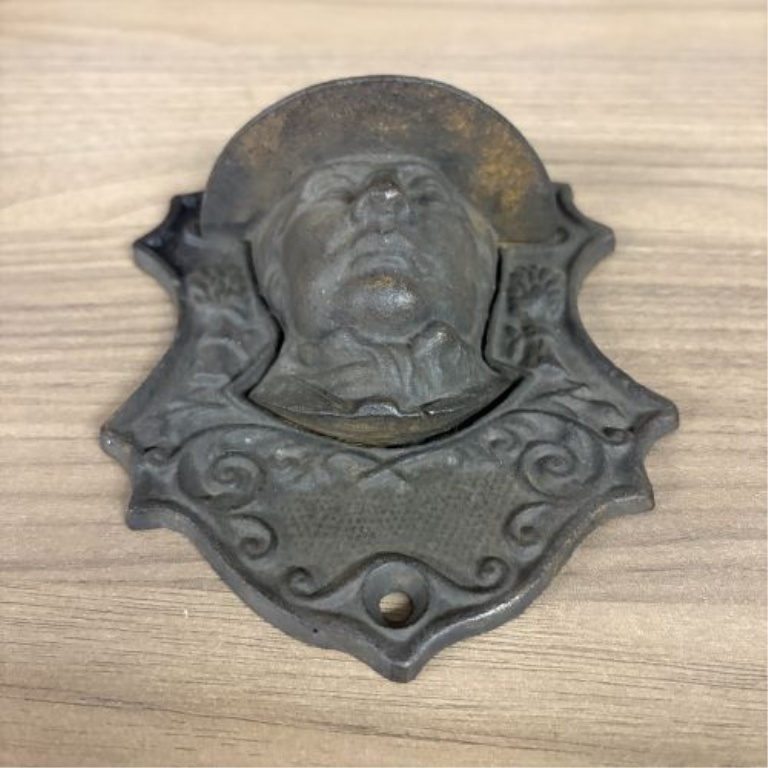 Two Victorian Cast Iron Wall-Mounted Match Pockets including Horace Greeley Depiction