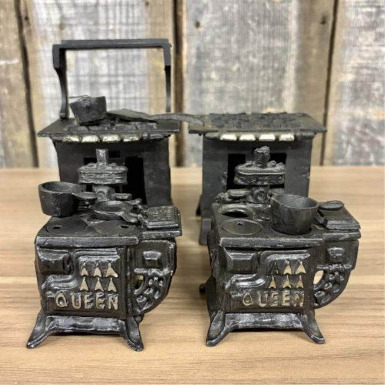 A Collection of Vintage Miniature Cast Iron Toy Stoves including Queen Models