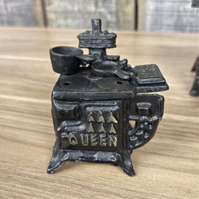 A Collection of Vintage Miniature Cast Iron Toy Stoves including Queen Models