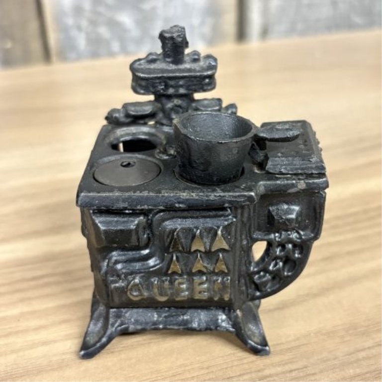A Collection of Vintage Miniature Cast Iron Toy Stoves including Queen Models
