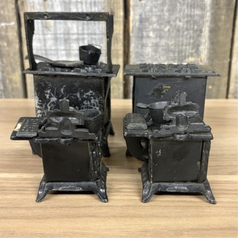A Collection of Vintage Miniature Cast Iron Toy Stoves including Queen Models