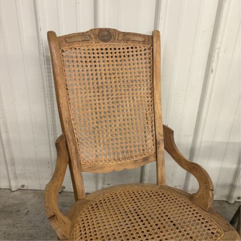 Two American Wooden Chairs including a Victorian Style Caned Rocker and a Press-Back Spindle Chair