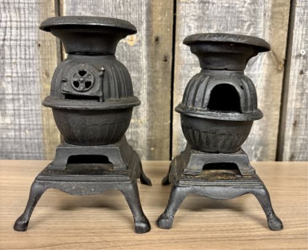 A Pair of Miniature Cast Iron Potbelly Stoves