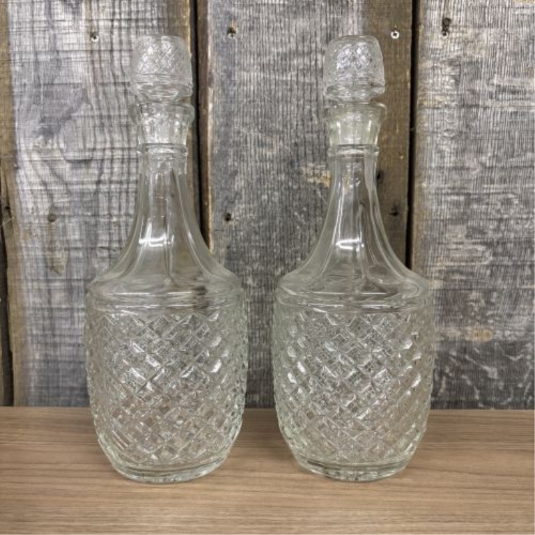 A Trio of Glass Spirit Decanters Including a Pair of Cut Glass and One Luigi Bormioli Style Example