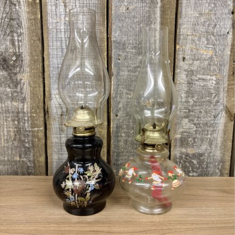 A Pair of Vintage Miniature Hurricane Oil Lamps with Black Floral and Christmas Gnome Bases