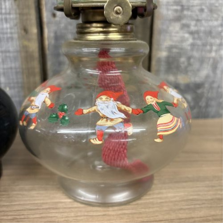 A Pair of Vintage Miniature Hurricane Oil Lamps with Black Floral and Christmas Gnome Bases