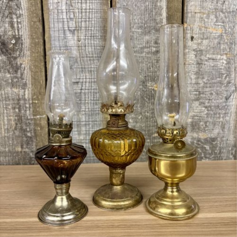 A Trio of Vintage Miniature Oil Lamps with Amber Glass and Metal Bases