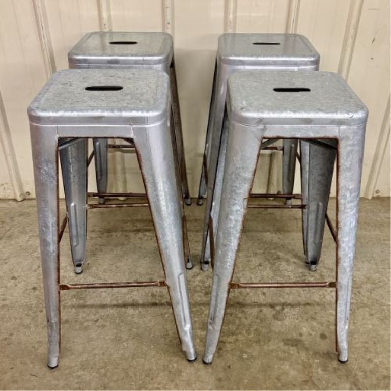 A Set of Four Industrial Distressed Metal Backless Bar Stools in the AmeriHome Loft Style