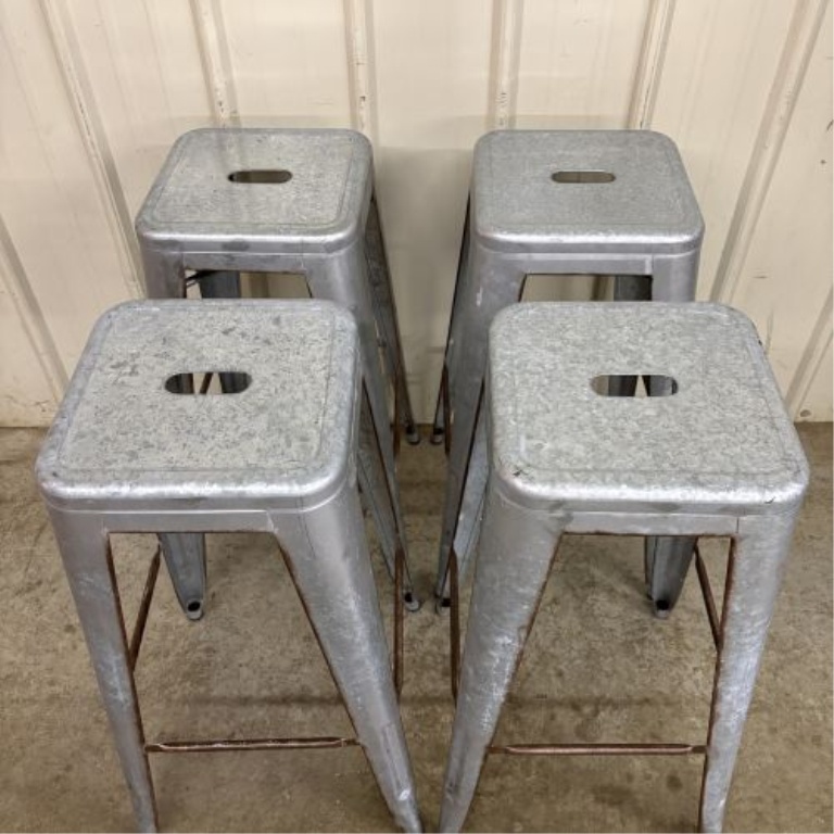 A Set of Four Industrial Distressed Metal Backless Bar Stools in the AmeriHome Loft Style