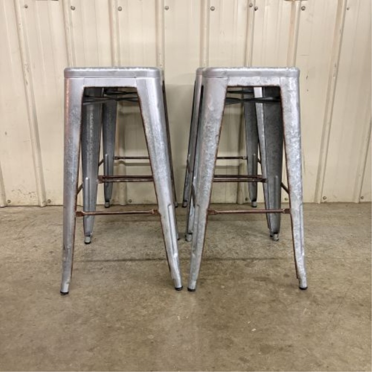 A Set of Four Industrial Distressed Metal Backless Bar Stools in the AmeriHome Loft Style