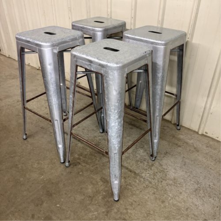 A Set of Four Industrial Distressed Metal Backless Bar Stools in the AmeriHome Loft Style