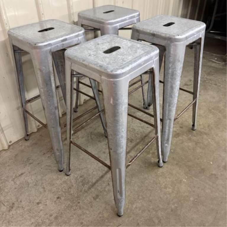 A Set of Four Industrial Distressed Metal Backless Bar Stools in the AmeriHome Loft Style