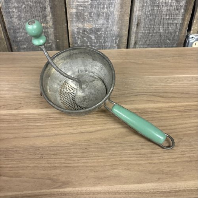 An Assortment of Vintage Mid-Century Kitchen Tools Including Nesco and Lorraine Metal Examples