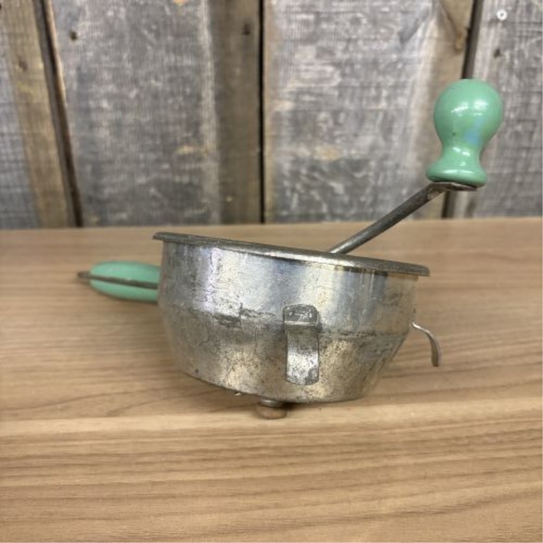 An Assortment of Vintage Mid-Century Kitchen Tools Including Nesco and Lorraine Metal Examples