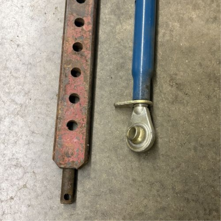 A Pair of Tractor Hitch Components Including Multi-Hole Drawbar and Adjustable Top Link