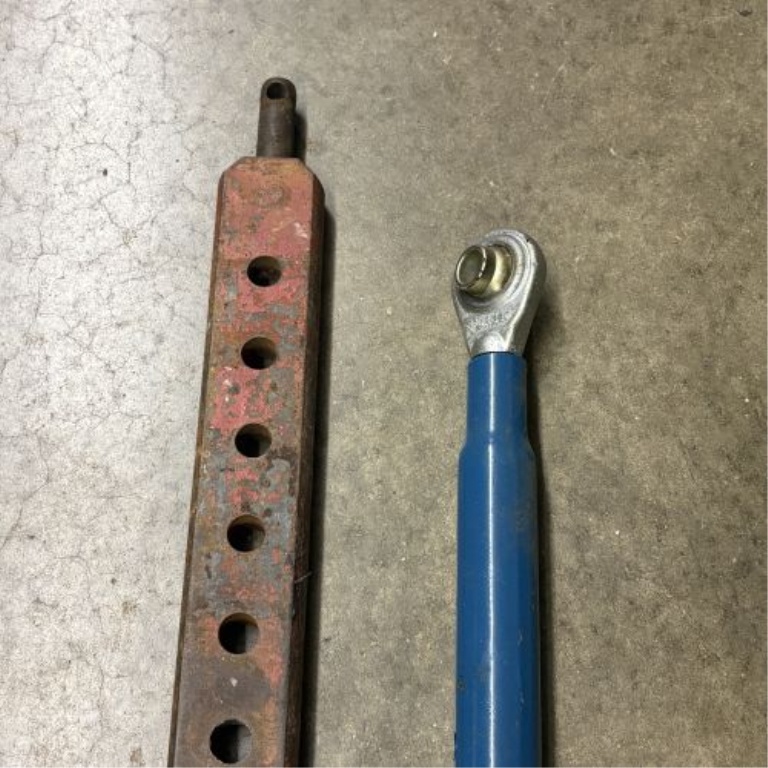 A Pair of Tractor Hitch Components Including Multi-Hole Drawbar and Adjustable Top Link
