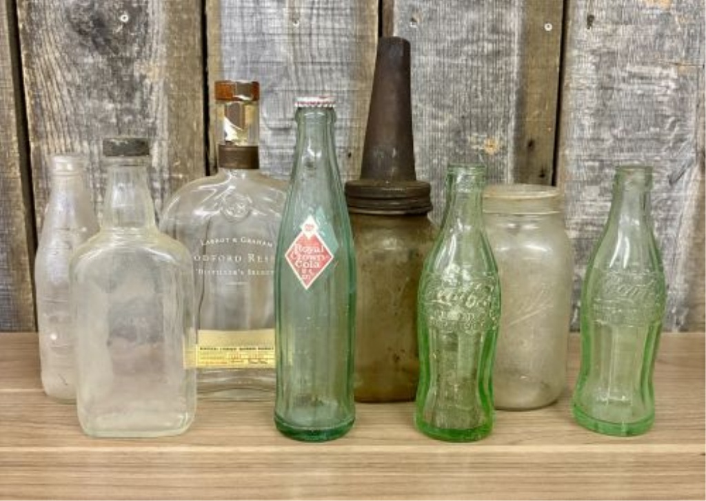 An Assortment of Vintage Glass Soda, Spirit, and Storage Containers