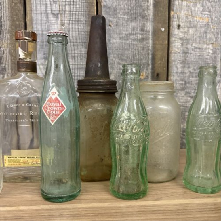 An Assortment of Vintage Glass Soda, Spirit, and Storage Containers