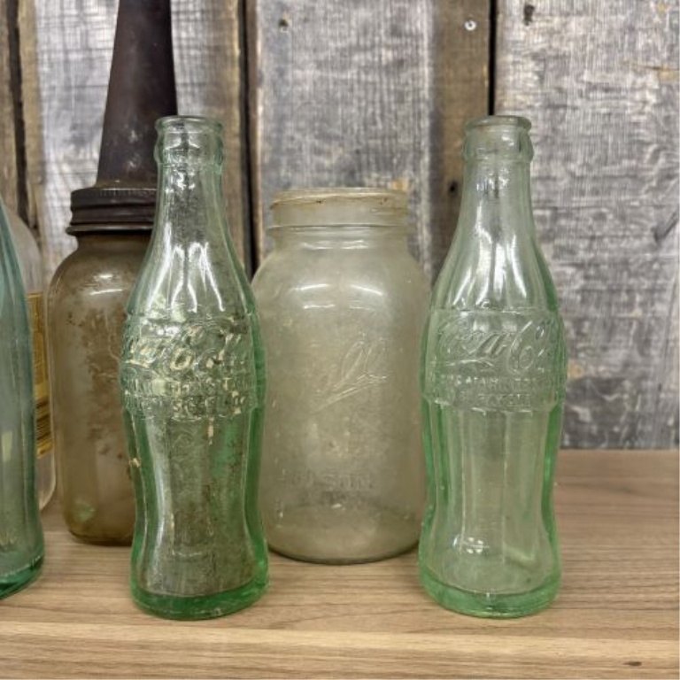 An Assortment of Vintage Glass Soda, Spirit, and Storage Containers