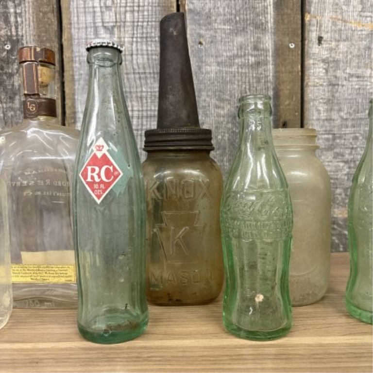 An Assortment of Vintage Glass Soda, Spirit, and Storage Containers