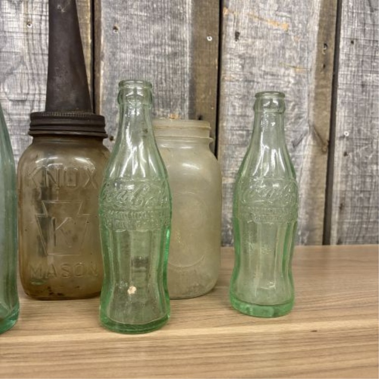 An Assortment of Vintage Glass Soda, Spirit, and Storage Containers