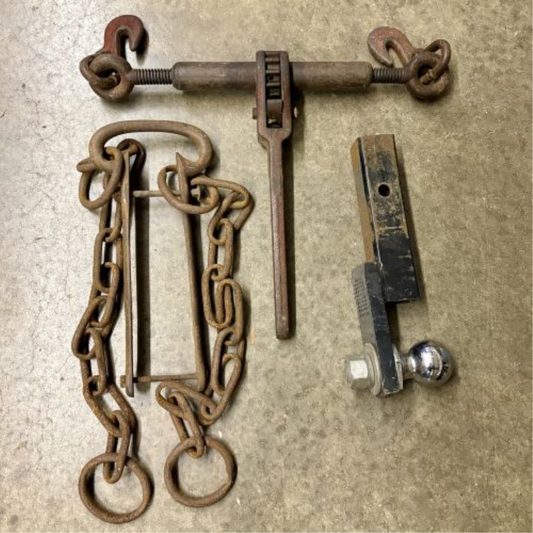 A Trio of Heavy-Duty Rigging and Towing Tools Including Ratchet Load Binder, Chain Assembly, and 2-5/16 Inch Ball Mount