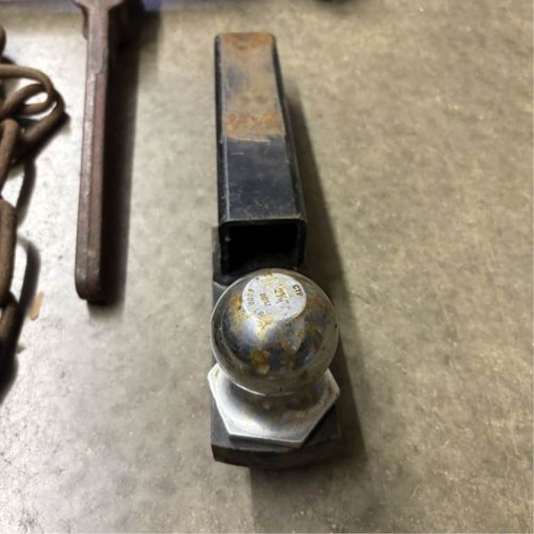 A Trio of Heavy-Duty Rigging and Towing Tools Including Ratchet Load Binder, Chain Assembly, and 2-5/16 Inch Ball Mount