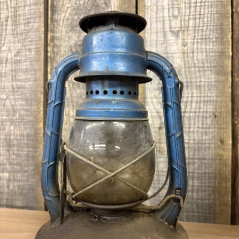 Two Vintage Portable Lamps Including a No. 100 Hurricane Lantern and an Amber Glass Lamp