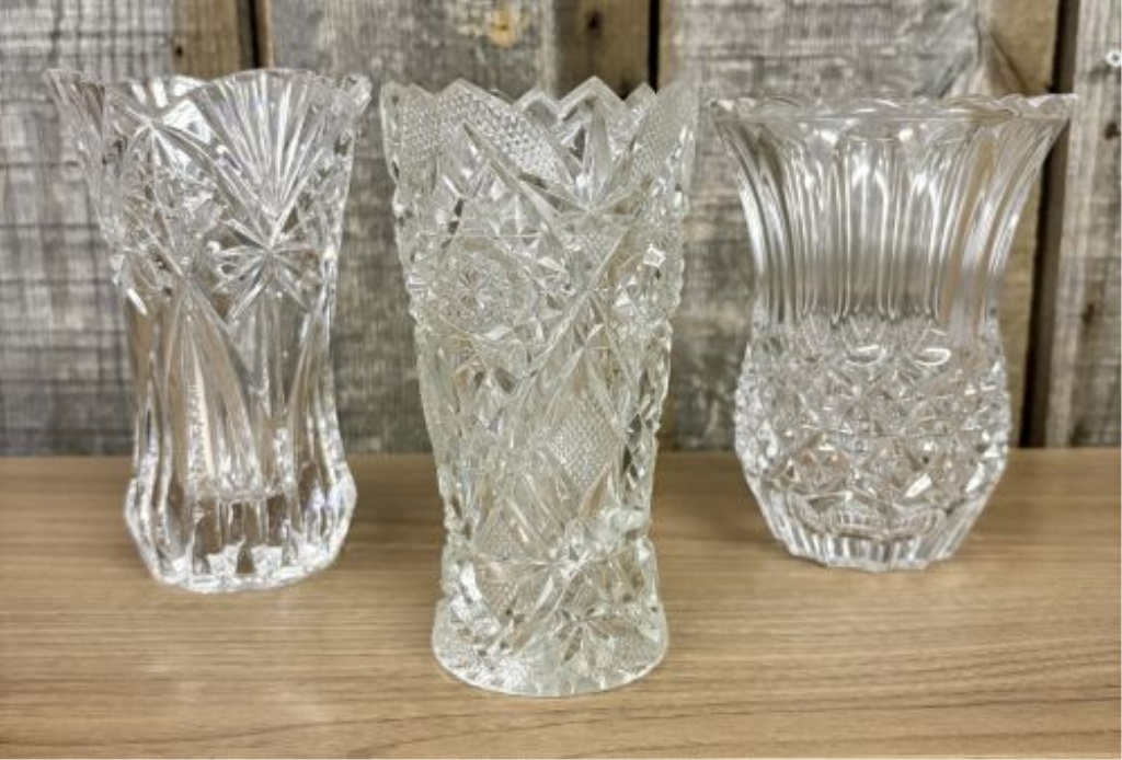 Three clear cut glass and lead crystal decorative vases including one attributed to Cristal d'Arques