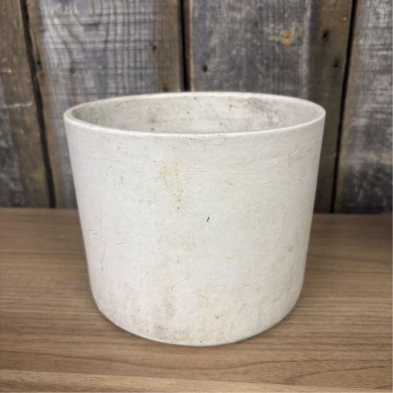 Two Pieces of American Utilitarian Stoneware Including a Two-Tone Jug and a Cylindrical Crock