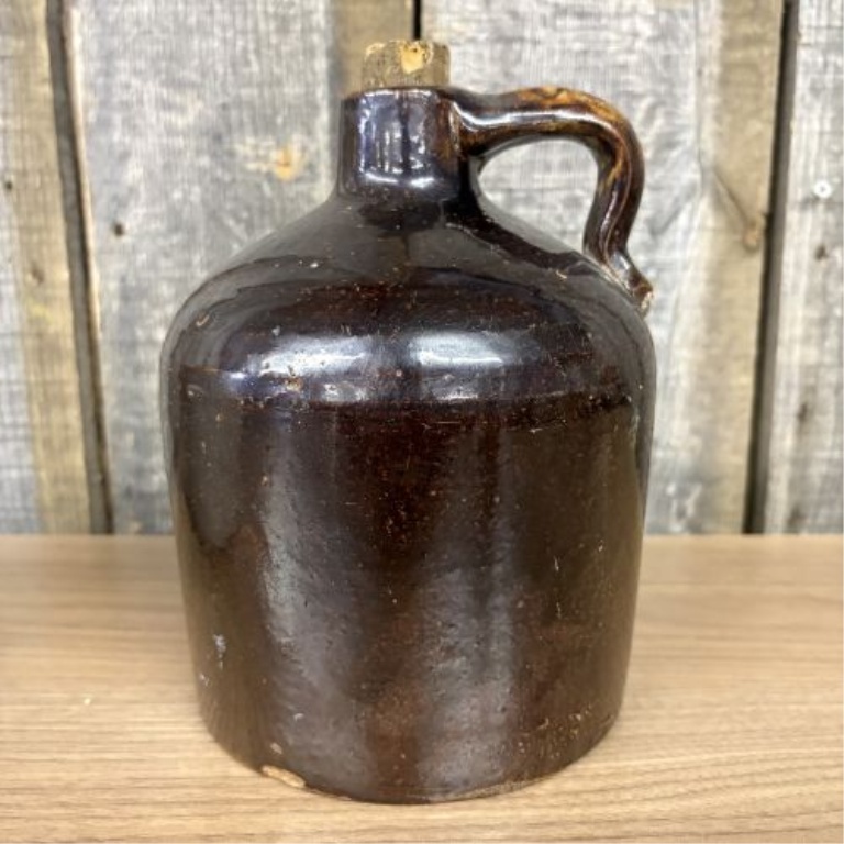Two Pieces of American Utilitarian Stoneware Including a Two-Tone Jug and a Cylindrical Crock