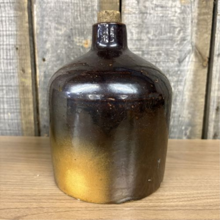 Two Pieces of American Utilitarian Stoneware Including a Two-Tone Jug and a Cylindrical Crock