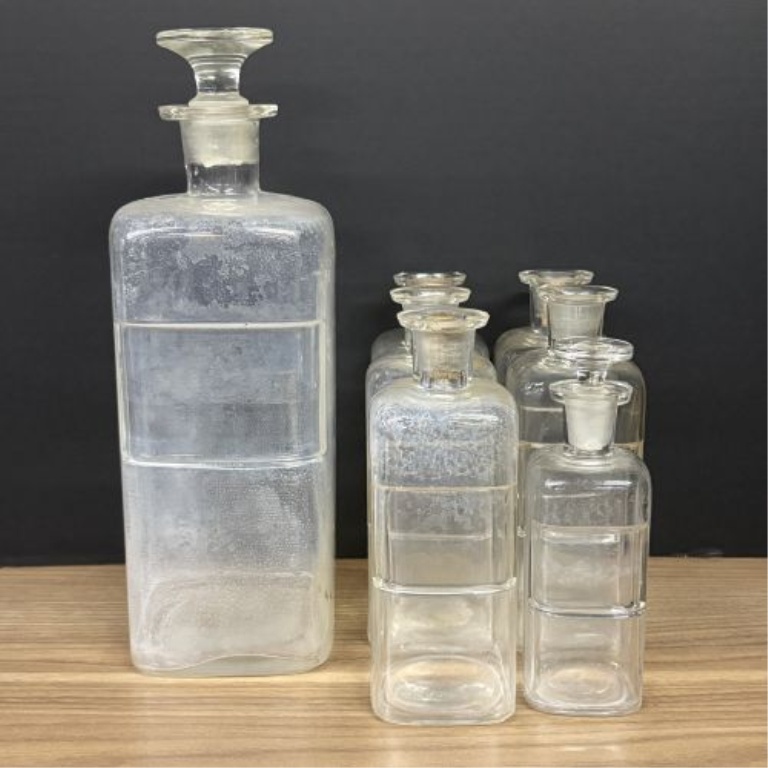 A Collection of Antique Clear Glass Apothecary Bottles Attributed to Whitall Tatum and Company