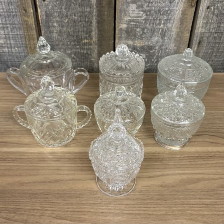 Seven Clear Glass Lidded Table Articles Including Pieces in the Style of Anchor Hocking Wexford