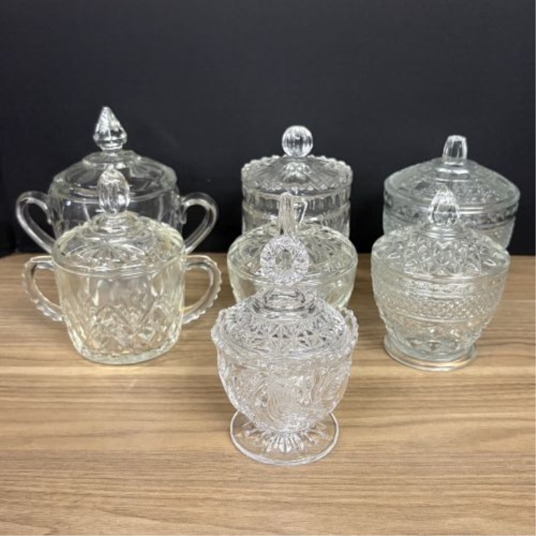 Seven Clear Glass Lidded Table Articles Including Pieces in the Style of Anchor Hocking Wexford