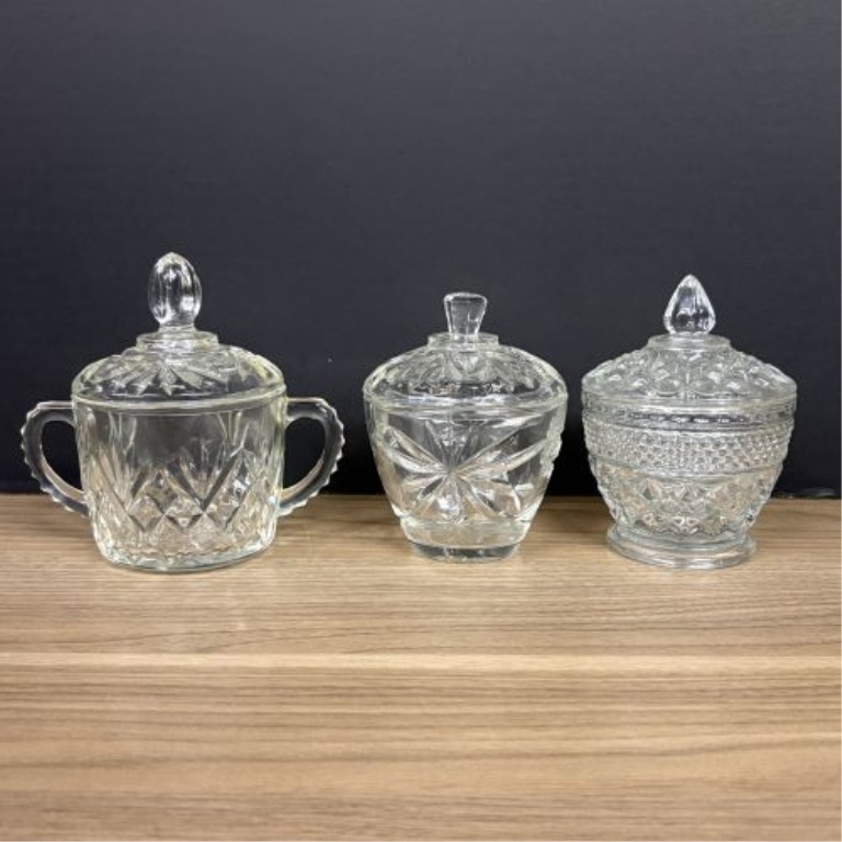 Seven Clear Glass Lidded Table Articles Including Pieces in the Style of Anchor Hocking Wexford