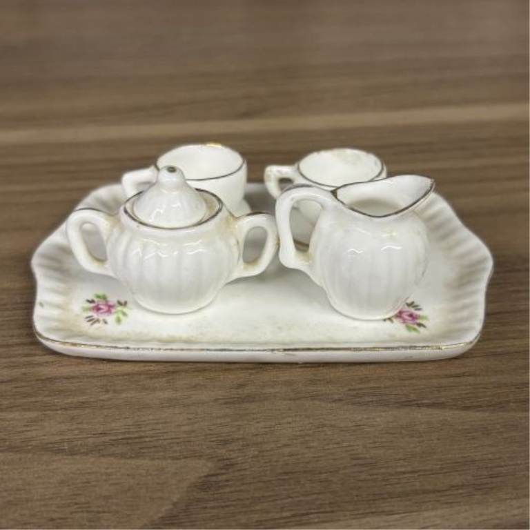 A Collection of 15 Miniature Porcelain Tea Service Pieces and Decorative Pitchers