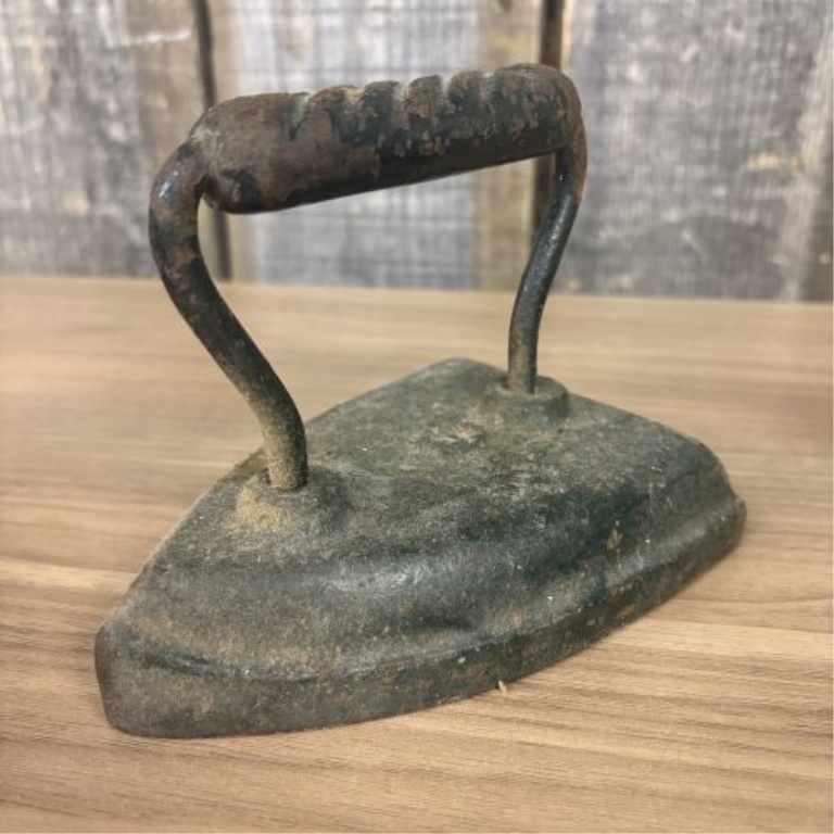 A Collection of Four Antique Cast Iron Sad Irons