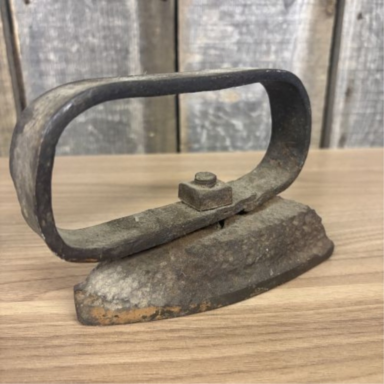 A Collection of Four Antique Cast Iron Sad Irons