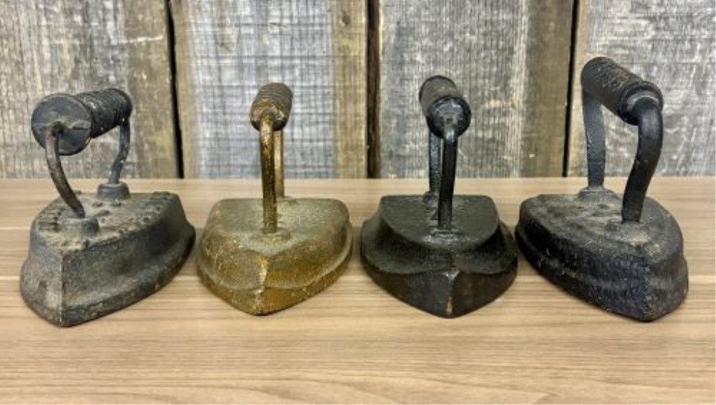 Set of Four Antique Cast Iron Sad Irons including Southern Queen Manufacturing Company