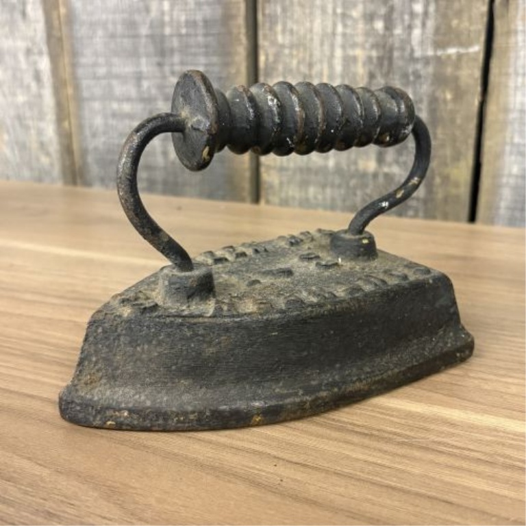 Set of Four Antique Cast Iron Sad Irons including Southern Queen Manufacturing Company