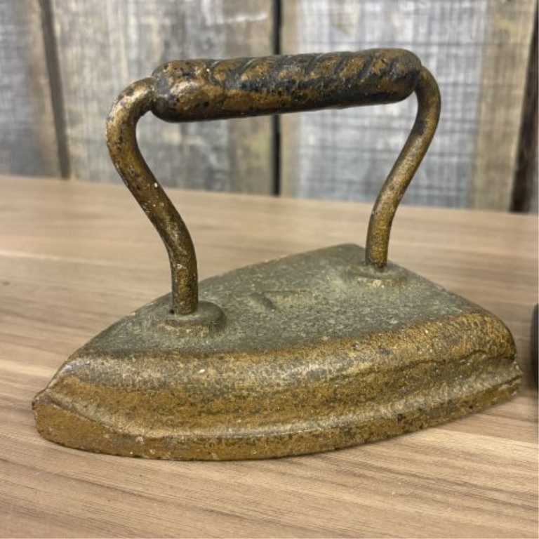 Set of Four Antique Cast Iron Sad Irons including Southern Queen Manufacturing Company