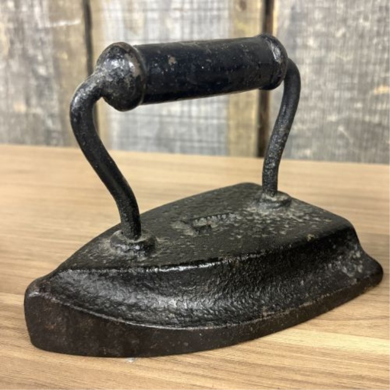Set of Four Antique Cast Iron Sad Irons including Southern Queen Manufacturing Company